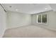 Bedroom with neutral carpet, a window providing natural light, and a sliding closet door at 7583 S Xanthia Ct, Centennial, CO 80112