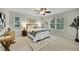 Spacious bedroom with a ceiling fan, generous natural light, and a cozy ambiance for relaxation and rest at 7583 S Xanthia Ct, Centennial, CO 80112