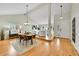 Elegant dining area with hardwood floors, vaulted ceilings, and ample natural light at 7583 S Xanthia Ct, Centennial, CO 80112