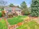 Aerial view of the home's back exterior, deck, and expansive fenced yard at 7583 S Xanthia Ct, Centennial, CO 80112