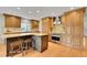 Modern kitchen with custom cabinetry, granite countertops, a center island, and stainless steel appliances at 7583 S Xanthia Ct, Centennial, CO 80112