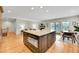 Kitchen island boasts stone countertops and drawers, with an adjacent breakfast nook and access to the living room at 7583 S Xanthia Ct, Centennial, CO 80112