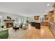 Inviting living room with a fireplace, comfortable seating, and an open layout with a modern kitchen at 7583 S Xanthia Ct, Centennial, CO 80112