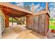 Covered patio beneath a raised deck with a concrete floor and lattice privacy screens at 7583 S Xanthia Ct, Centennial, CO 80112