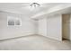 Finished basement area with neutral carpet, a window, and closet for storage at 1707 Ostia Cir # 46, Lafayette, CO 80026