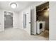 Finished basement area with carpet, showing access to laundry and another finished room at 1707 Ostia Cir # 46, Lafayette, CO 80026