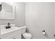 Bathroom featuring a white vanity with a black faucet and a toilet at 1707 Ostia Cir # 46, Lafayette, CO 80026