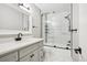 Modern bathroom with stylish vanity, quartz countertop, and glass enclosed shower with marble tiling at 1707 Ostia Cir # 46, Lafayette, CO 80026