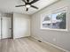 Bright bedroom featuring wood-look flooring, natural light from a window, and a closet at 1707 Ostia Cir # 46, Lafayette, CO 80026