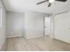 Spacious bedroom featuring light gray walls, wood-look flooring, and a ceiling fan at 1707 Ostia Cir # 46, Lafayette, CO 80026