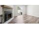 Bright living room features fireplace, wood floors, and sliding door access to outside patio at 1707 Ostia Cir # 46, Lafayette, CO 80026