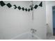 Clean bathroom showcases tiled shower with decorative accents and modern fixtures at 655 N Pearl St # 208, Denver, CO 80203