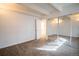 Carpeted bedroom with closet doors and an adjacent bathroom at 655 N Pearl St # 208, Denver, CO 80203