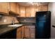 Well-lit kitchen features updated appliances and a functional layout for cooking at 655 N Pearl St # 208, Denver, CO 80203
