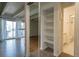 An open living room has a closet view, an entrance to the bathroom, and an entrance to the balcony at 655 N Pearl St # 208, Denver, CO 80203