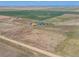 Aerial view showing house, outbuildings, and expansive property at 8441 Flint Ridge St, Bennett, CO 80102