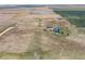 Wide aerial view of the property and surrounding landscape at 8441 Flint Ridge St, Bennett, CO 80102