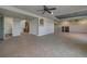 Spacious finished basement with tile flooring, fireplace, and ample natural light at 8441 Flint Ridge St, Bennett, CO 80102