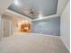 Finished basement with built-in shelving and high ceilings at 8441 Flint Ridge St, Bennett, CO 80102