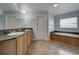 Elegant bathroom with double sinks and a soaking tub at 8441 Flint Ridge St, Bennett, CO 80102