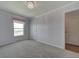 Bright bedroom with neutral walls and carpet flooring at 8441 Flint Ridge St, Bennett, CO 80102