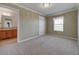 Charming bedroom with neutral decor and adjacent bath at 8441 Flint Ridge St, Bennett, CO 80102