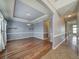 Spacious dining room with hardwood floors and light blue walls at 8441 Flint Ridge St, Bennett, CO 80102