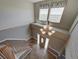 Bright entryway with chandelier and staircase to upper level at 8441 Flint Ridge St, Bennett, CO 80102