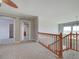 Spacious upper hallway with carpet and ceiling fan at 8441 Flint Ridge St, Bennett, CO 80102