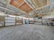 Large workshop with high ceilings and ample space for storage and projects at 8441 Flint Ridge St, Bennett, CO 80102