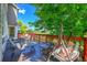 Back deck with comfortable seating and view of green space at 17826 E Cloudberry Dr, Parker, CO 80134