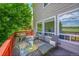 Back deck with cozy seating and picturesque view of open fields at 17826 E Cloudberry Dr, Parker, CO 80134