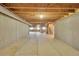 Unfinished basement with utilities, stairs, windows, and ample room for storage or future expansion at 17826 E Cloudberry Dr, Parker, CO 80134