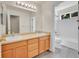Bathroom featuring double sinks and a shower-tub combo at 17826 E Cloudberry Dr, Parker, CO 80134