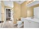Clean bathroom with white vanity, toilet, and a shower/tub combo, showcasing a functional layout at 17826 E Cloudberry Dr, Parker, CO 80134