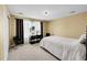 Comfortable bedroom with neutral tones, large window, and minimalist decor for a serene atmosphere at 17826 E Cloudberry Dr, Parker, CO 80134