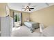 Inviting bedroom featuring neutral decor, a twin bed, and ample natural light for a cozy feel at 17826 E Cloudberry Dr, Parker, CO 80134