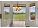 Eat-in dining area with beautiful chandelier and picturesque views of the surrounding landscape at 17826 E Cloudberry Dr, Parker, CO 80134
