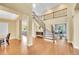 Stunning foyer with a grand staircase and wood floors at 17826 E Cloudberry Dr, Parker, CO 80134