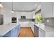 Modern kitchen with white cabinets, stainless steel appliances, and a center island at 17826 E Cloudberry Dr, Parker, CO 80134