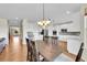 Open concept kitchen and dining area with stainless appliances, island, and lots of space at 17826 E Cloudberry Dr, Parker, CO 80134