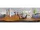 Spacious open-concept layout with kitchen, dining, and living areas bathed in natural light at 17826 E Cloudberry Dr, Parker, CO 80134