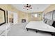 Serene main bedroom with a cozy fireplace, ample windows, and a bright, airy atmosphere at 17826 E Cloudberry Dr, Parker, CO 80134