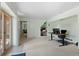 Basement with beige carpet, an office space, and access to the backyard at 27231 Log Trl, Conifer, CO 80433