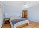 Relaxing bedroom with hardwood floors, ceiling fan and neutral color scheme at 27231 Log Trl, Conifer, CO 80433