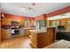 Cozy kitchen featuring stainless steel appliances, wood cabinets and lots of sunlight at 27231 Log Trl, Conifer, CO 80433