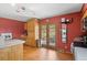 Spacious kitchen with wood cabinets and stainless steel refrigerator with backyard views at 27231 Log Trl, Conifer, CO 80433