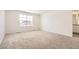 An empty bedroom is shown with a plush carpet and lots of bright light at 537 Nightsky St, Erie, CO 80516