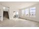 Spacious living room featuring bright light, hardwood floors, and staircase at 537 Nightsky St, Erie, CO 80516