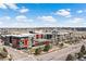 Modern apartment complex boasts striking architecture, outdoor pool, and convenient access to surrounding roads at 7770 W 87Th Dr # F, Arvada, CO 80005